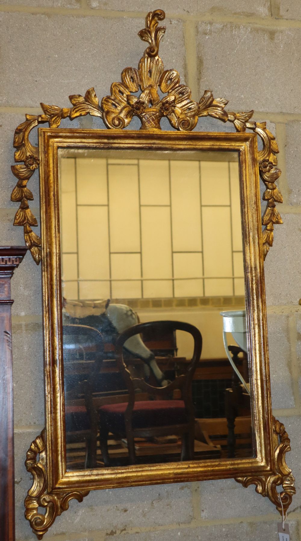 A giltwood and gesso wall mirror, W.58cm, H.110cm